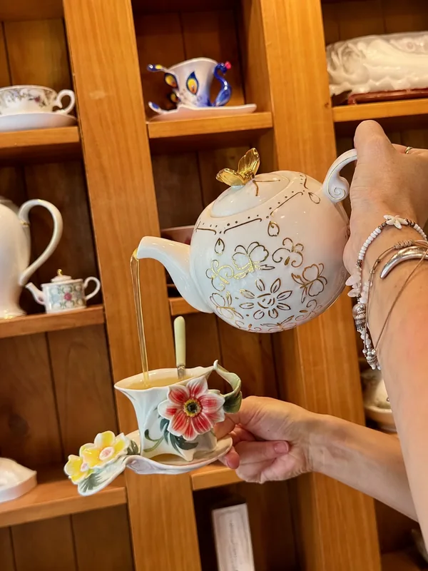 A floral teapot and matching cup at Therapy Coffee