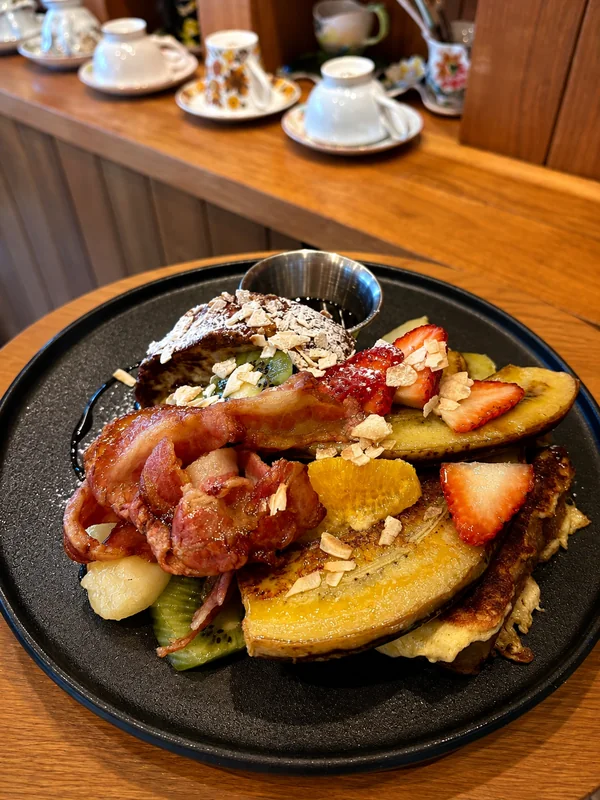 French toast with bacon, grilled banana and fruit